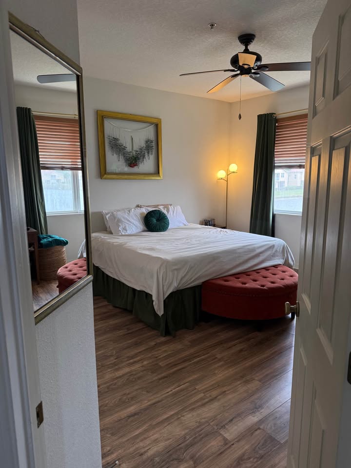 Primary bedroom with hardwood floors