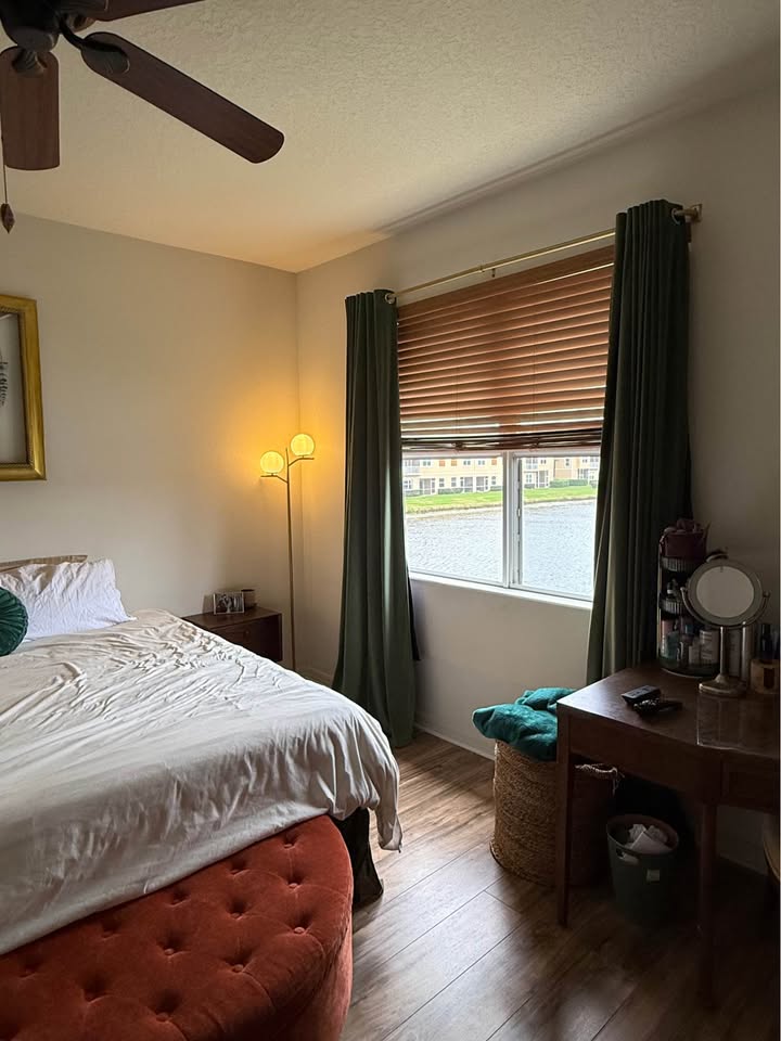 Primary bedroom with lake view window